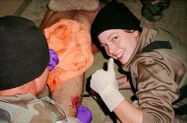 Spc. Lynndie England apparently taking honor in the barbarity that his just occured.
